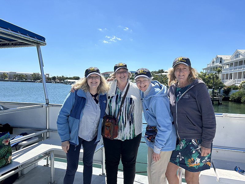 A group of lifelong friends celebrated the Wolverines’ College Football Playoff National Championship on the Atlantic Ocean during a recent boat trip in Key West, Florida. From left to right are: Carol Smith Sandy, ’78, Jo Connelly del Junco, ’78, MSW’80, Rosanne Charles Acciaioli, ’78, MS’85, and Erin Keeley, ’78.