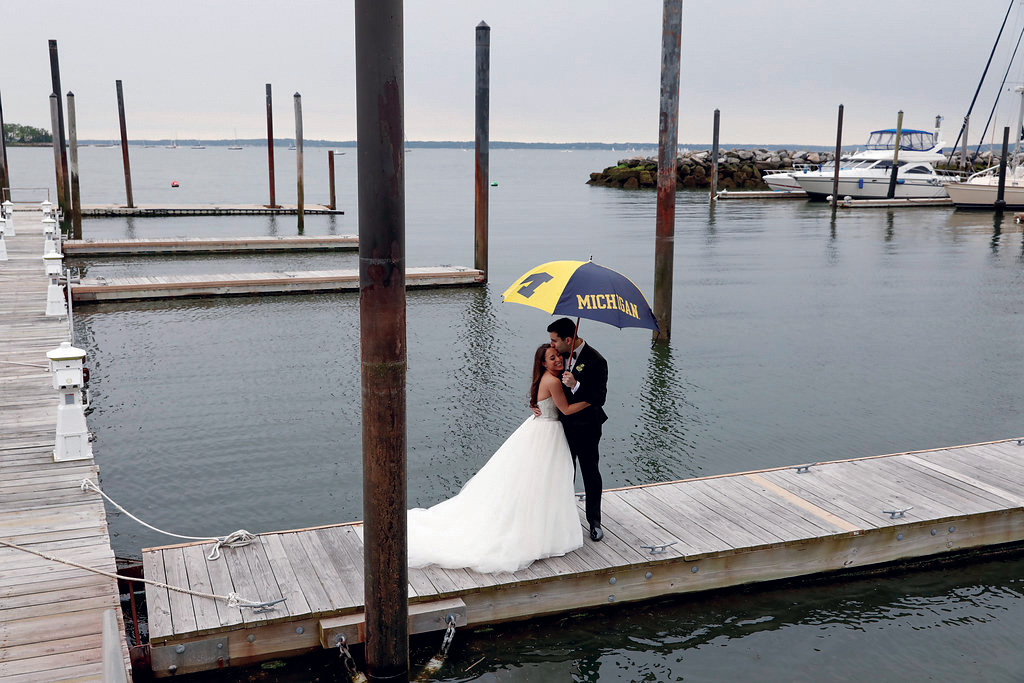 Amy and Richard Schafrann, ’76, watch proudly as their daughter Sara, ’12, married Jeremy Diamond, ’11, at the Mamaroneck Beach & Yacht Club in Mamaroneck, New York.