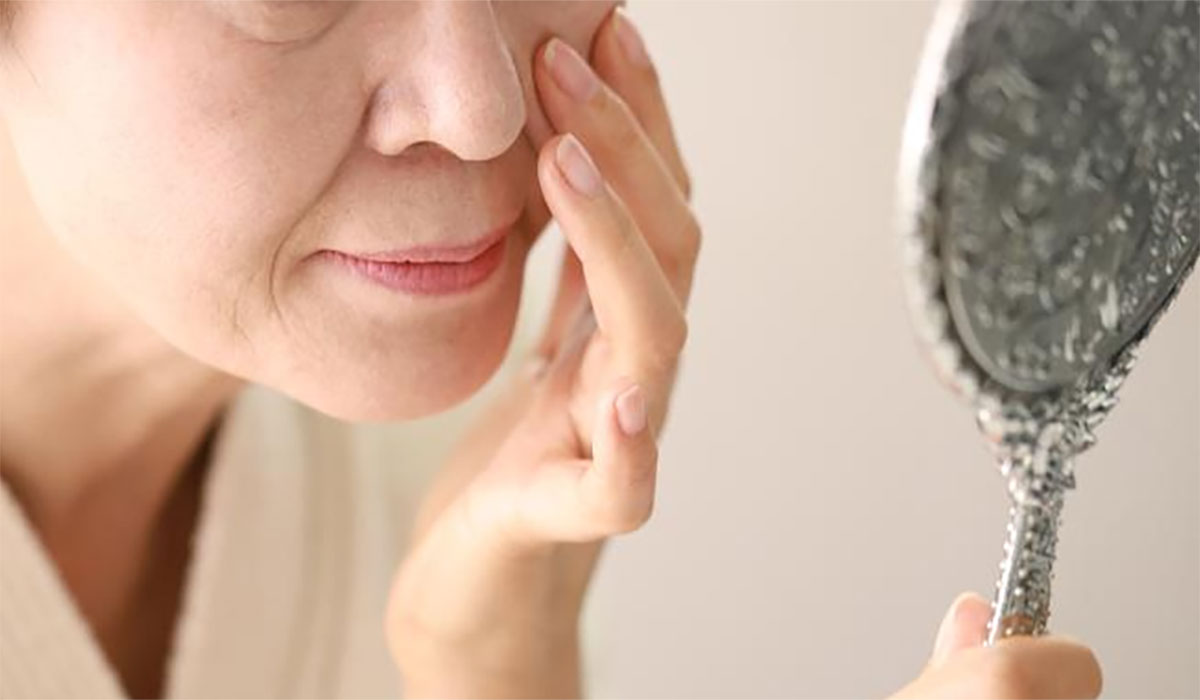 Senior Woman Checking Face Mirror