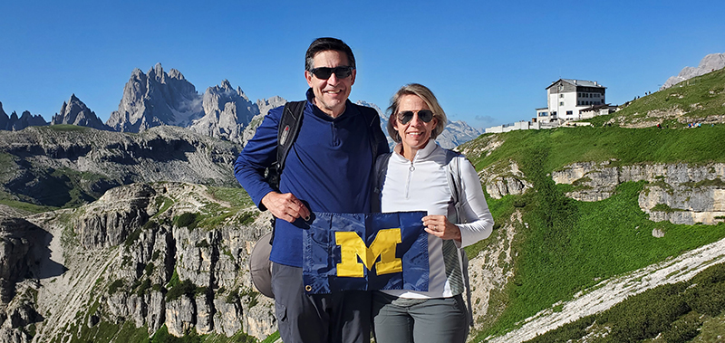 Steve Shindler, ’85, and Mary Kay Kosnik, ’83, flew the U-M colors on the Tre Cime di Lavaredo hike, in the Sexten Dolomites of Italy, during a recent trip.