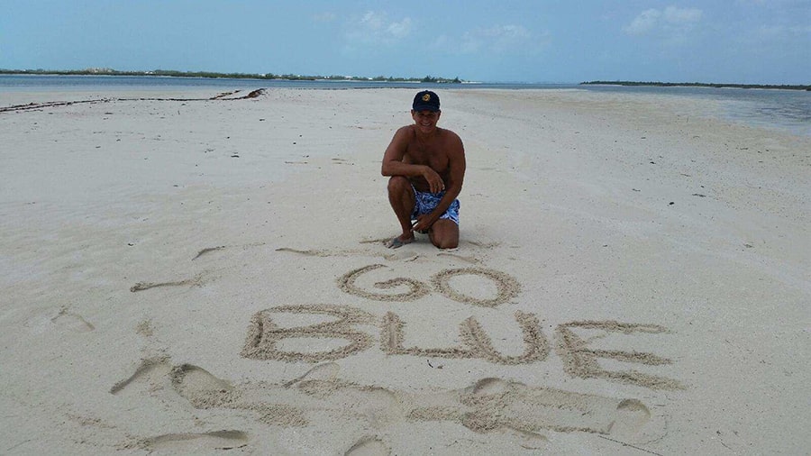 Rob Shumay, ’86, left a message in the sands of an uninhabited island of the Turks and Caicos.