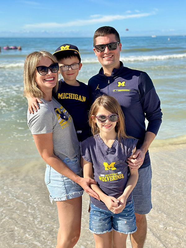 The Stratton family of Kyle, ’06, MBA’15, Kendra, Kyrie, and Kasen, represented the Maize and Blue on New Year's Day 2024 before the big game while at Clearwater Beach, Florida.
