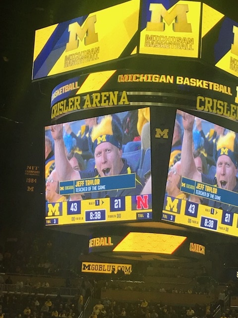 Jeff Taylor, ’00, was spotlighted as “Teacher of the Game” at the last Wolverine basketball home of the 2018-19 season—a game that turned out to be head coach John Beilein's last game at Crisler Center. Jeff is in his 20th year teaching, all in the Ann Arbor Public School, and has coached over 75 youth sport teams. He is a middle school science teacher at Clague Middle School.