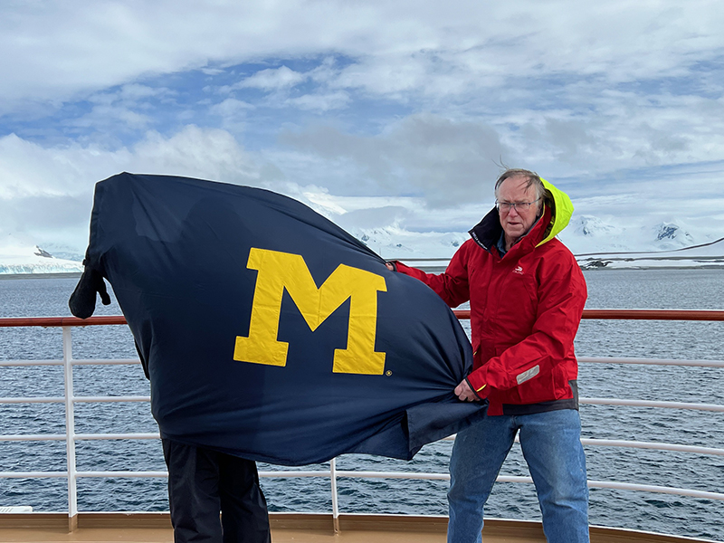 In January, Mike, ’71, MS’74, and Karen Teeley (behind the flag) took the U-M flag on its seventh continental visit aboard the Viking Octantis ship in Antarctica. The flag continued its tradition of creating instant recognition and initiating wonderful conversations with fellow alums.