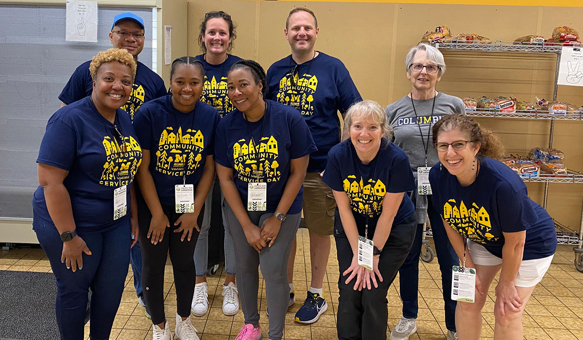 Members of the U-M Club of Central Ohio pose for a group photo during a Community Service Day event.