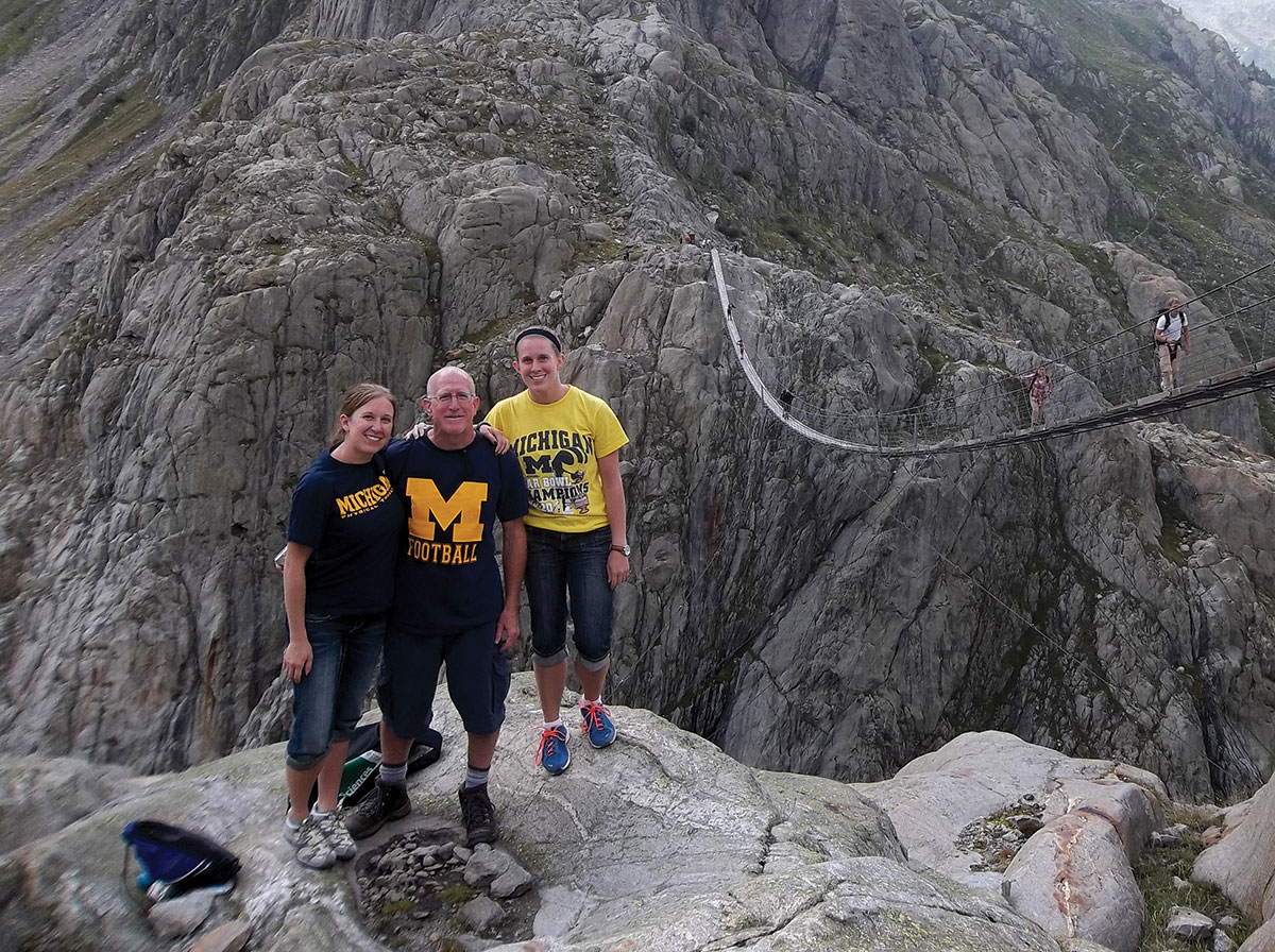 At 560 feet in length, the Trift Bridge is the longest pedestrian-only bridge in the Swiss Alps and a perfect backdrop for the Ryan family, from left: Dayna, ’07, DPT’10, her father, David, ’84, and her sister, Jessica, ’12—now a University of Geneva doctoral student.