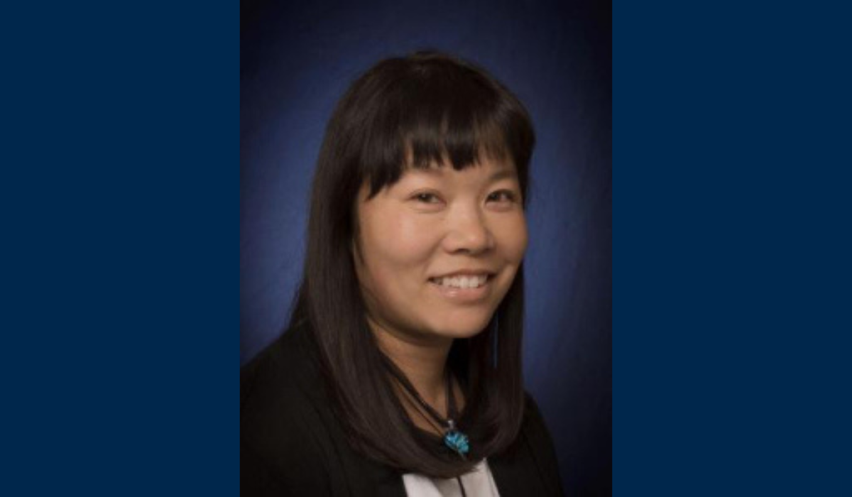 Lisa Yee-Litzenberg's headshot on a blue background.