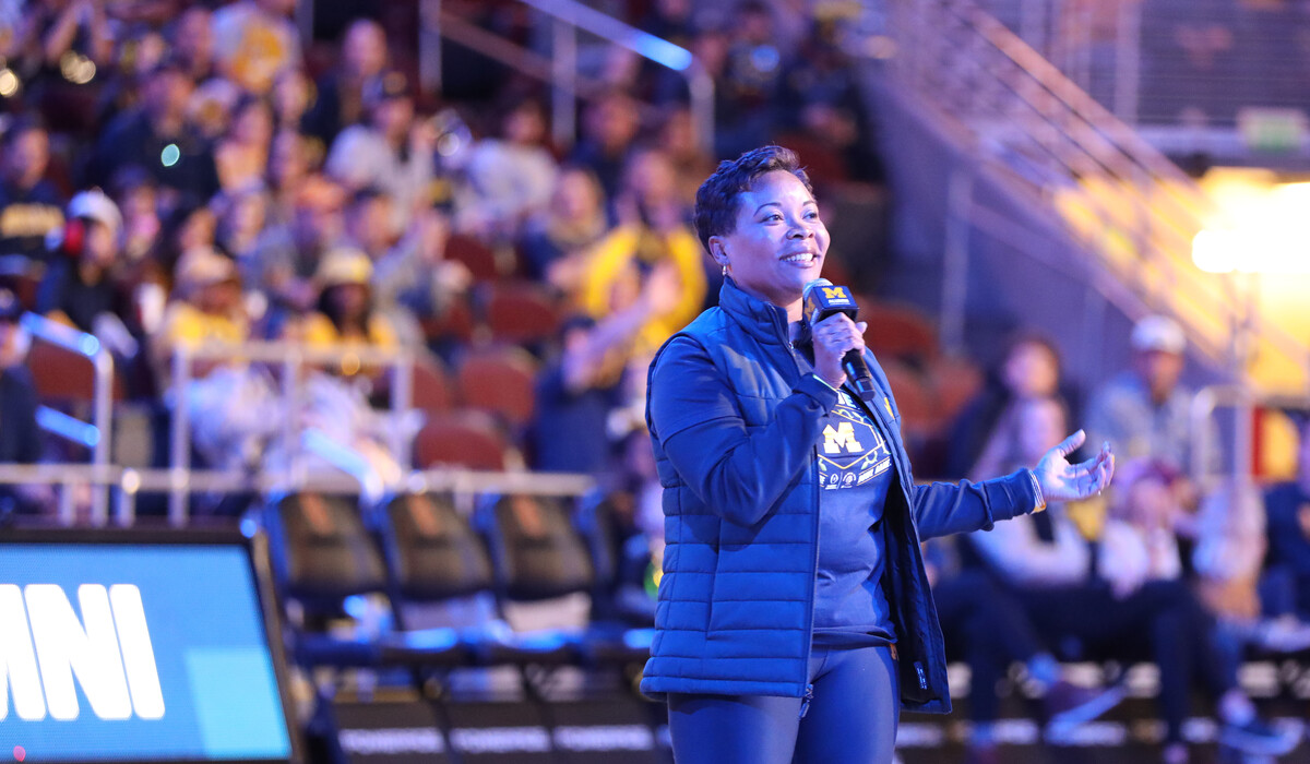 Ayanna McConnell speaking to audience members at the 2023 Alumni Territory Rose Bowl Pep Rally.