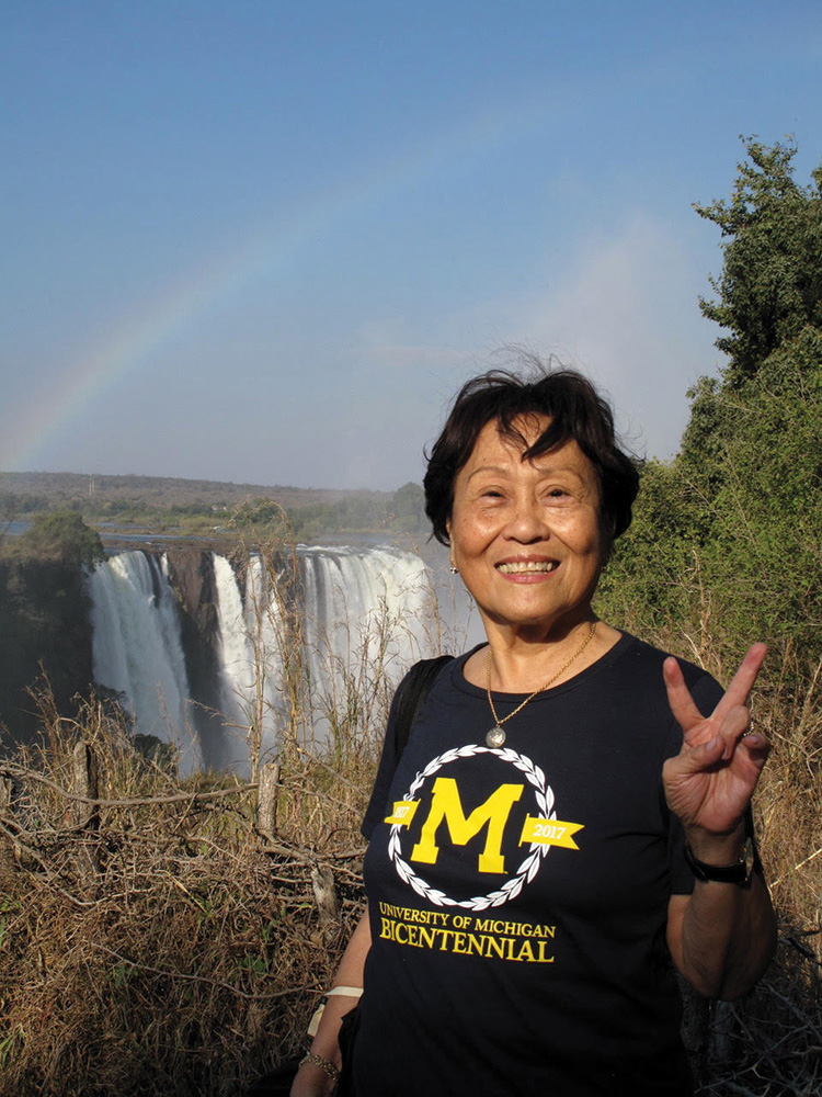 Aurora Sevilla, MA’57, celebrated the University’s bicentennial at the Victoria Falls in Zimbabwe.