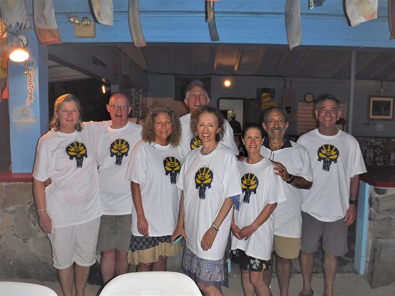 The “Jolly Roger” (Wolverine-style) flew high on this visit to Little Harbor on Jost Van Dyke of the British Virgin Islands. From left to right: Marlene Vitasinski; Harold Nelson, ’74, JD’77; Debby Wachter; Bill Garber; Luann Garber, MPH’80; Sally Wachter, ’73; Mark Wachter, ’72, MA’73; and Doug Wachter, ’74.