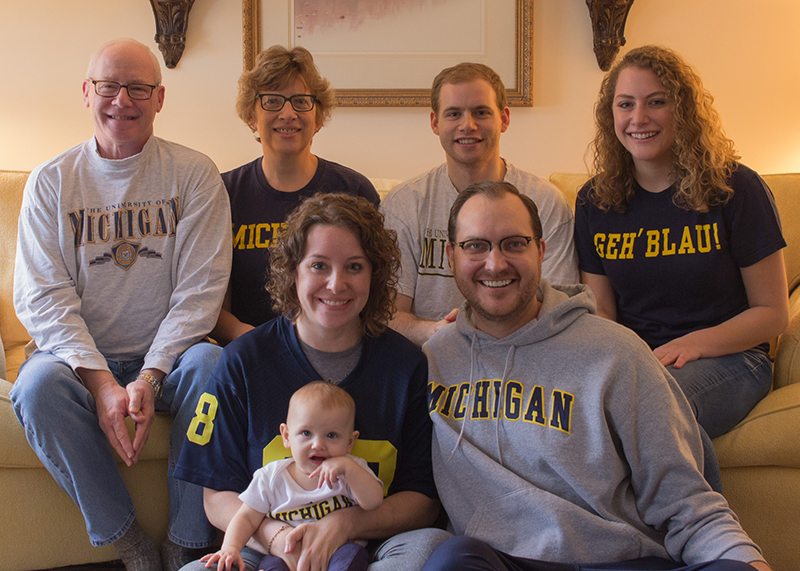 A “Kalish Klan” gathering in Syracuse, New York, before watching the 2016 U-M vs. Ohio State game. Back row (from left): <strong>Randy Kalish, ’73, MDRES’83; Elizabeth Schultz Kalish, ’79; Paul and Lauren Kalish Front Row: Molly Kalish Eymann, MHSA’10, MPH’10; Timothy Eymann, PhD’13; and future Wolverine Eleanor Eymann