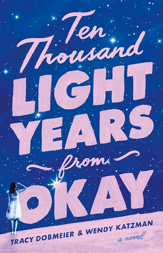 The cover of "Ten Thousand Light Years from Okay" which features a navy background and light pink lettering.