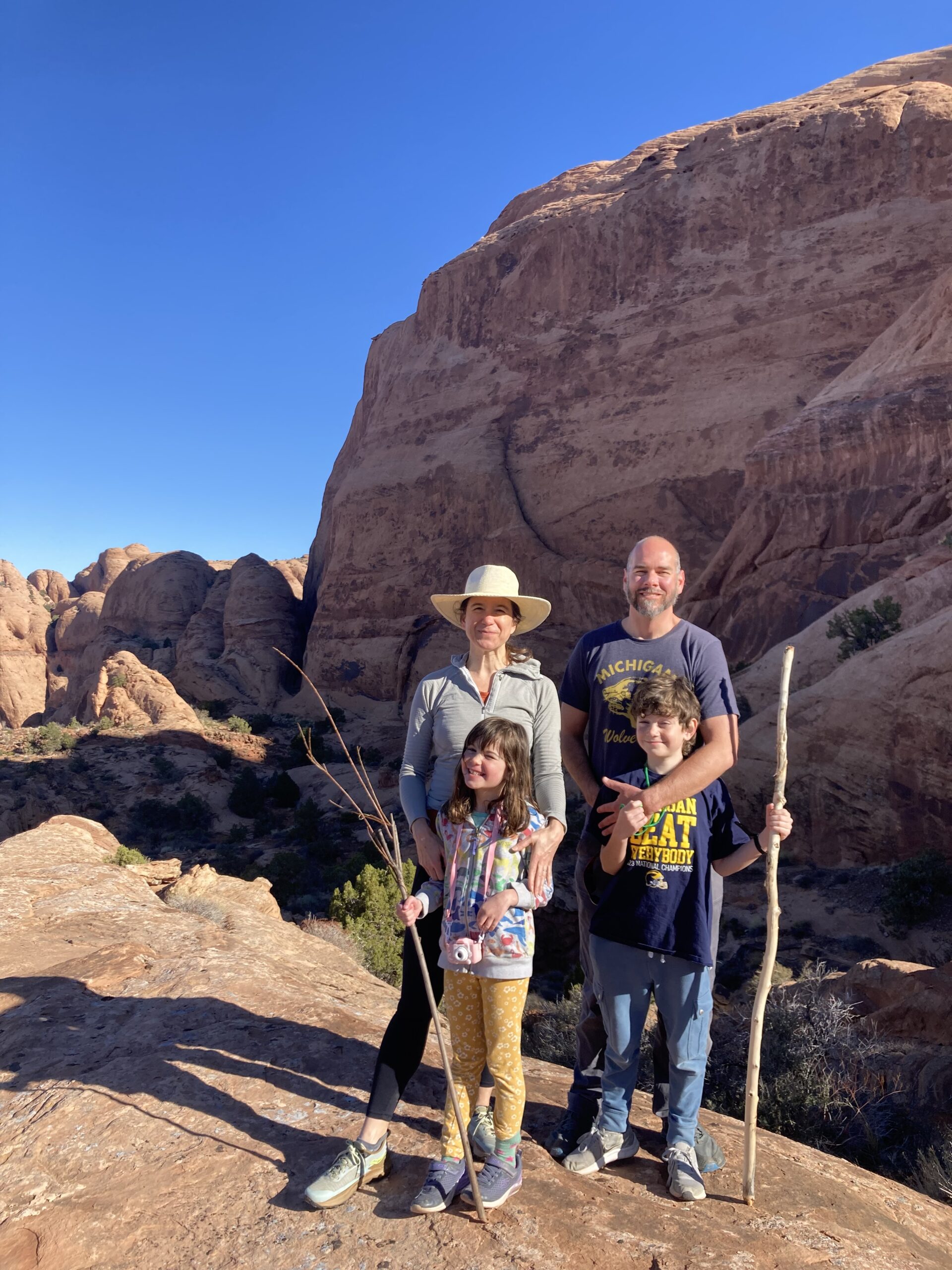 The Wakild family stopped for a photo to show their Michigan pride during a hiking journey through Mill Creek Canyon in Moab, Utah. Susan Wakild, ’69, is behind the camera; her son, Eric Wakild, ’99, and his wife, Emily, are in the back row; and grandchildren Charlotte and Ray stand in front.