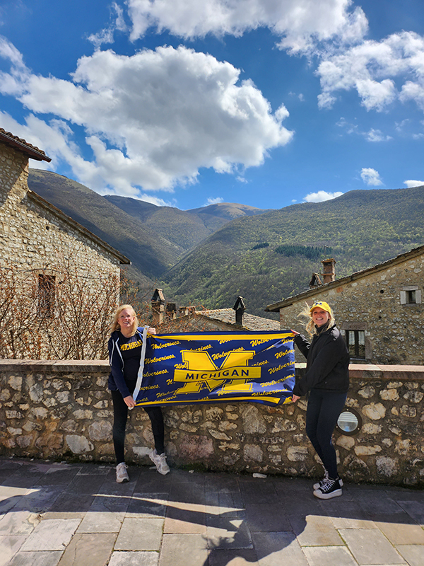 Mother-daughter duo Katherine Wandersee, ’83, and Olivia McKenzie, ’22, converted a village in Umbria, Italy, to Wolverine fans.