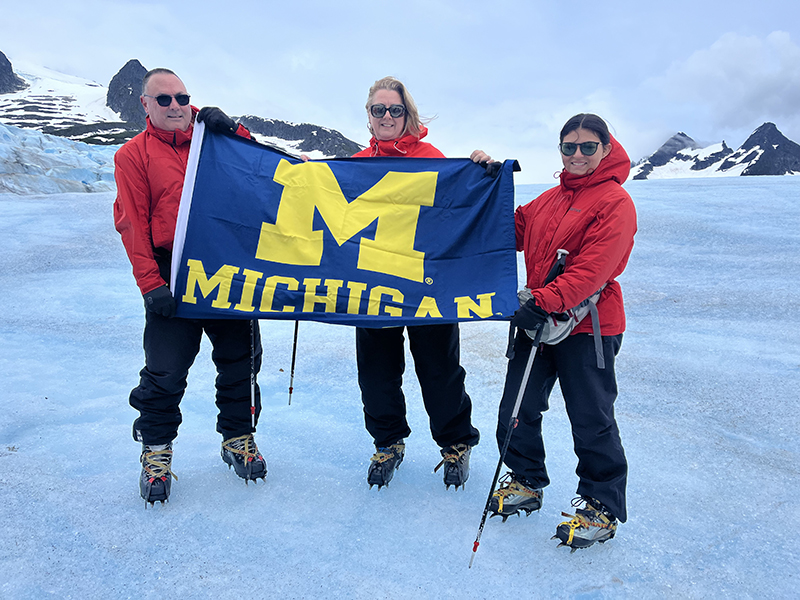 David Wilsey, ’85, with his wife, Caroline, and their daughter, Sally, showing Michigan pride on the 4th of July on Mendenhall Glacier in Alaska.