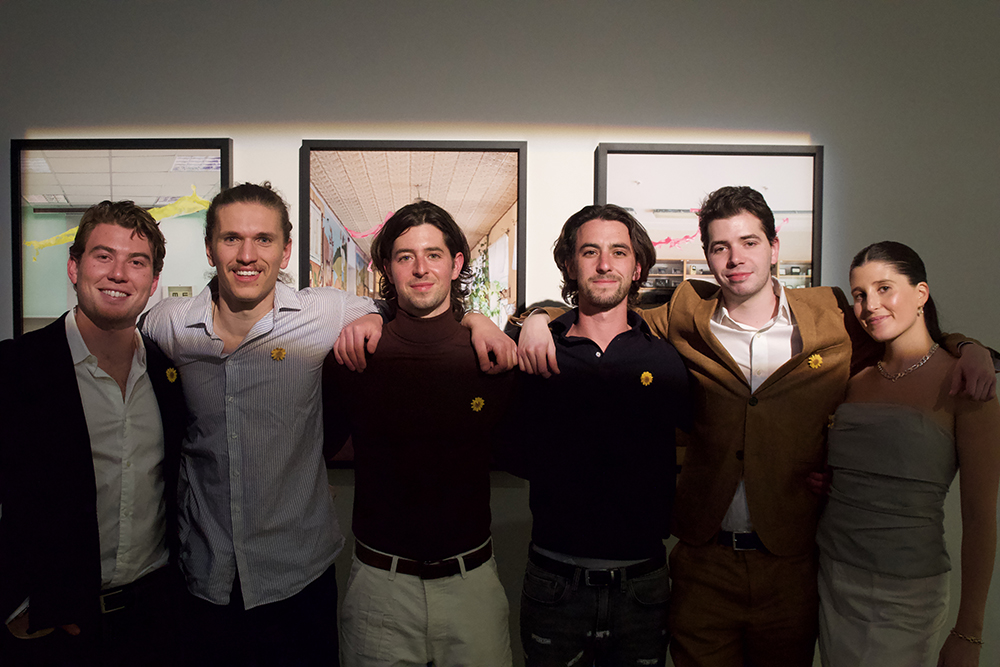 Zach Steinfeld, ’22, Jack Chase, ’21, Dustin Ross, ’18, Dean Ross, ’21, Sonya Gallery co-director Dylan Siegel, and Emma Bernstein, ’18, pose for a photo within Sonya Gallery.