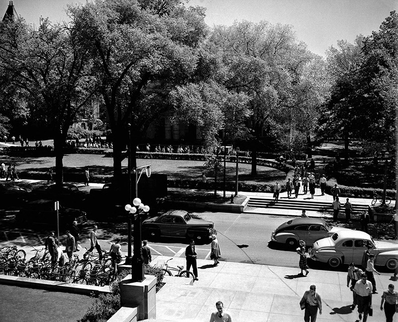 1947: A view from the Michigan Union steps shows that, despite the ban, cars rolled through the campus streets. With both the University and Ann Arbor growing in size, traffic and parking would soon become bigger issues.