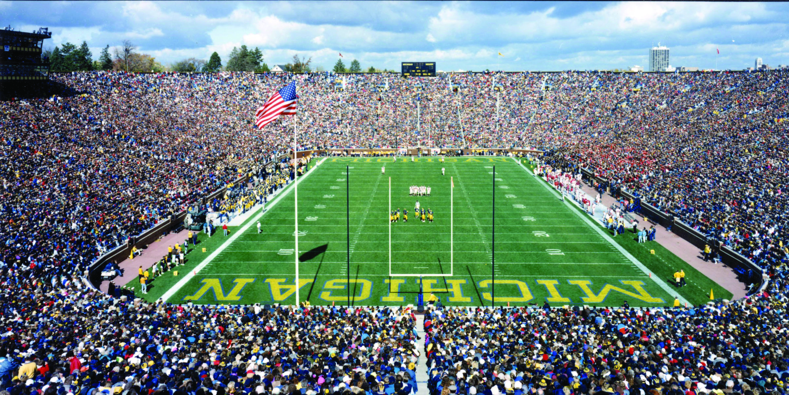 Michigan Stadium football field with the stands full of fans