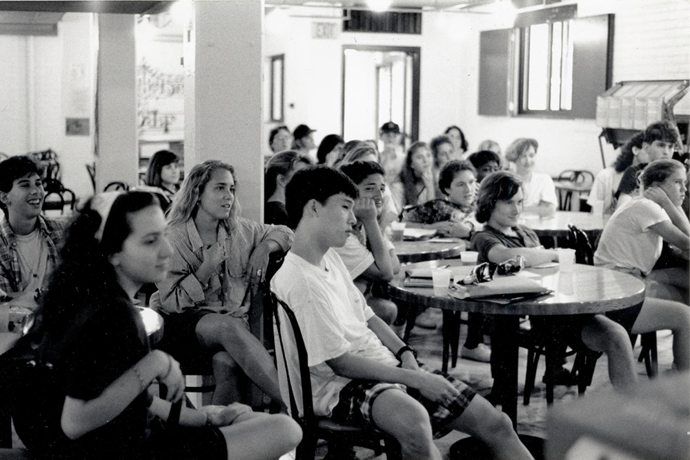 Residential College students watch a skit in 1992 in The Halfway Inn, a combination cafe, lounge, and convenience shop located in the basement of the East Quad residence hall.