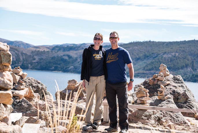 Jacalyn, ’97, and Kenneth Bishop, ’93, stand more than 12,500 feet above sea level on Isla Suasi in the waters of Lake Titicaca, Peru.