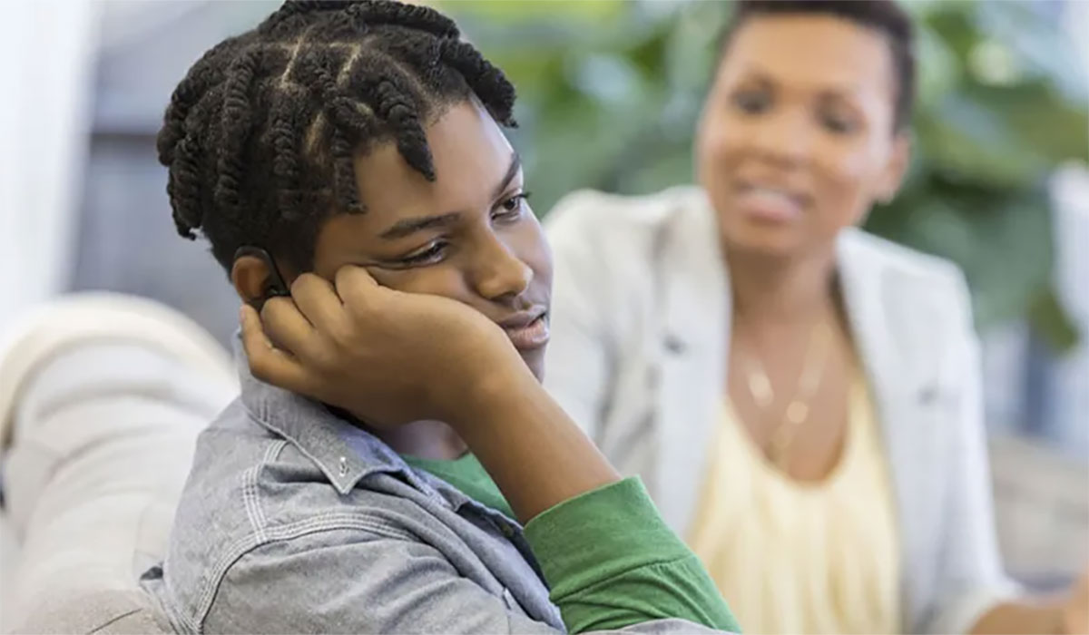 Depressed Male Teen With Mother