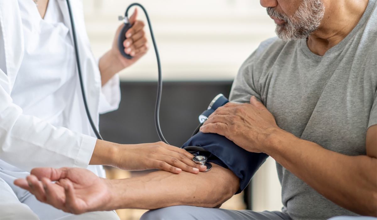 Doctor Checking Pulse Senior Man