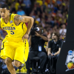 Michigan basketball's Trey Burke dribbles at the Final Four