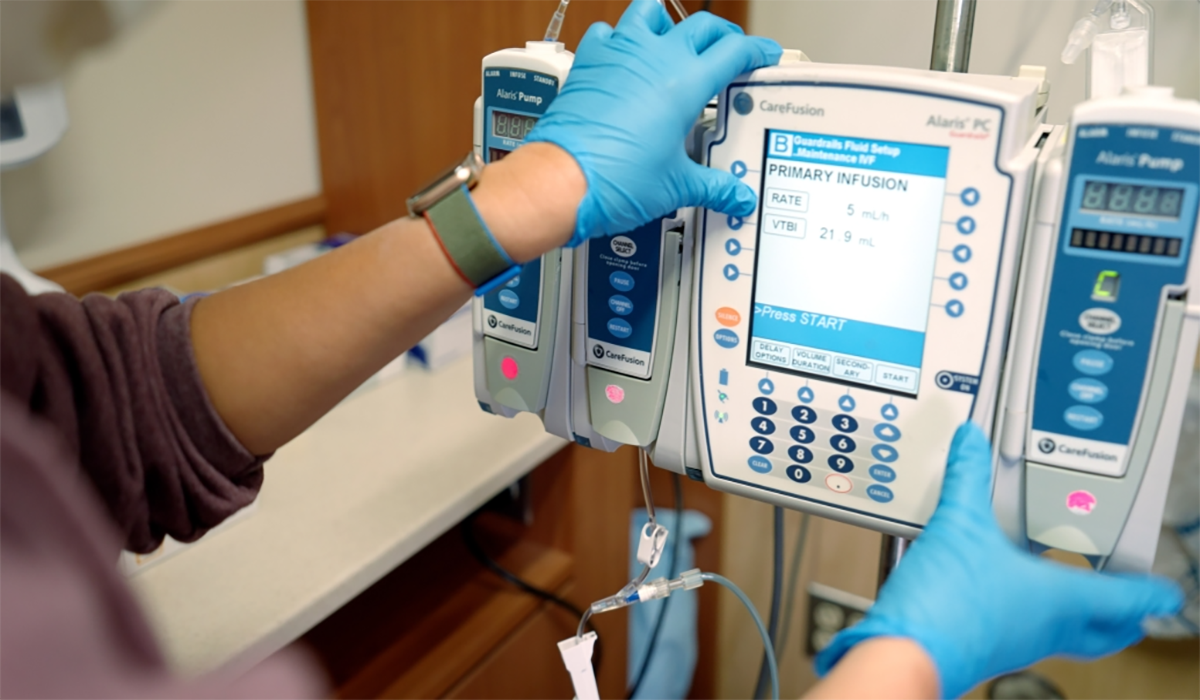 Infusion Device Nurse Gloved Hands