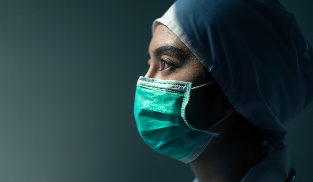 Masked Woman Surgeon Serious Somber