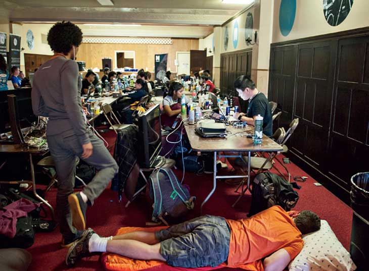 Nothing gets in the way of a good hack, not even a sleeping colleague. The augmented reality/virtual reality cortex on the third floor of the Masonic Temple was one of the many areas where students could meet with others working on similar hacks.