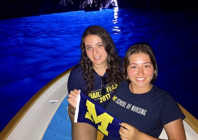 Patricia Petrella Nouhan, ’85, snapped a shot of her daughter, LSA student Catherine (left), and niece, nursing student Rebecca Petrella, bringing a little Maize to the Grotta Azzurra (Blue Grotto) of Capri, Italy.