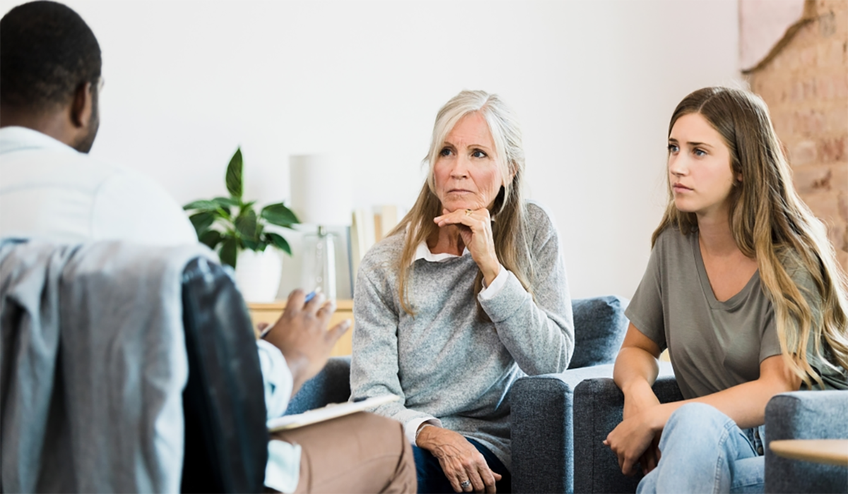 Older Woman Younger Woman Talk With Counselor