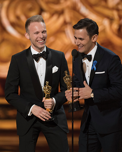 Pasek and Paul accept the Oscar for best song on Feb. 26. They wrote the lyrics for half a dozen tunes in the movie “La La Land,” including the winning song, “City of Stars.”