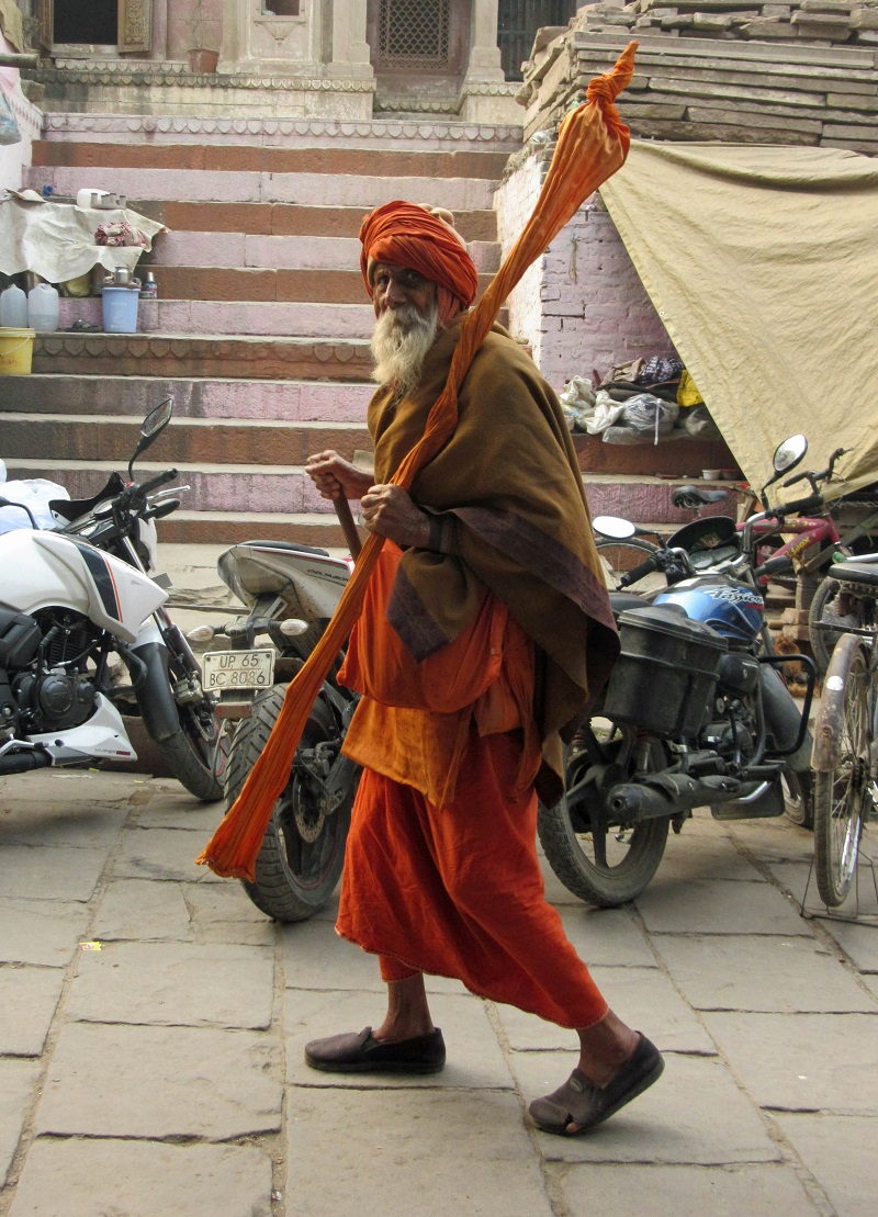 Category: Culture - A holy man with his staff in Varanasi, India (Photo by Chris Knaggs, ’75)