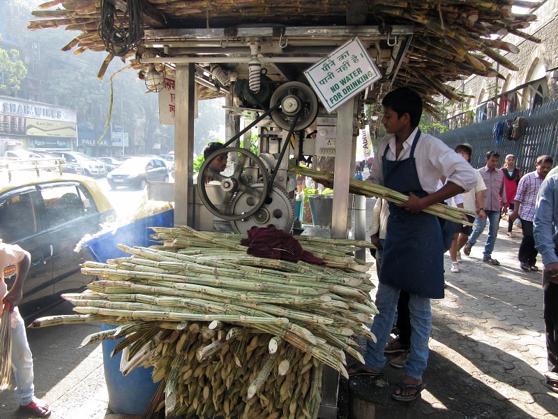 Category: Learning - Squeezing sugar cane in Mumbai, India (Photo by Chris Knaggs, ’75)