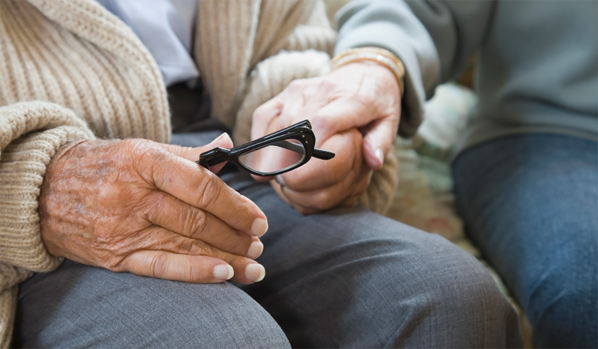 Senior Couple Holding Hands Glasses