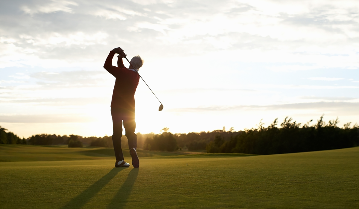 Senior Man Golfing Sunset Swing