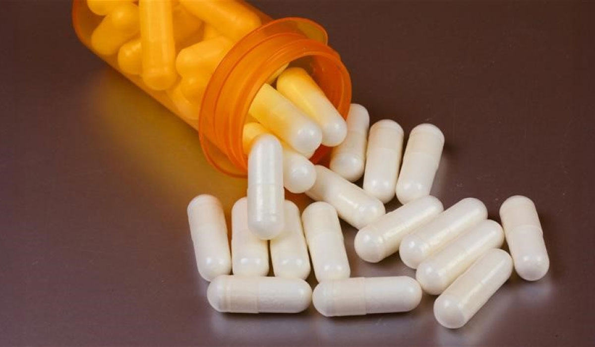 V2pills Spilling Out Orange Bottle