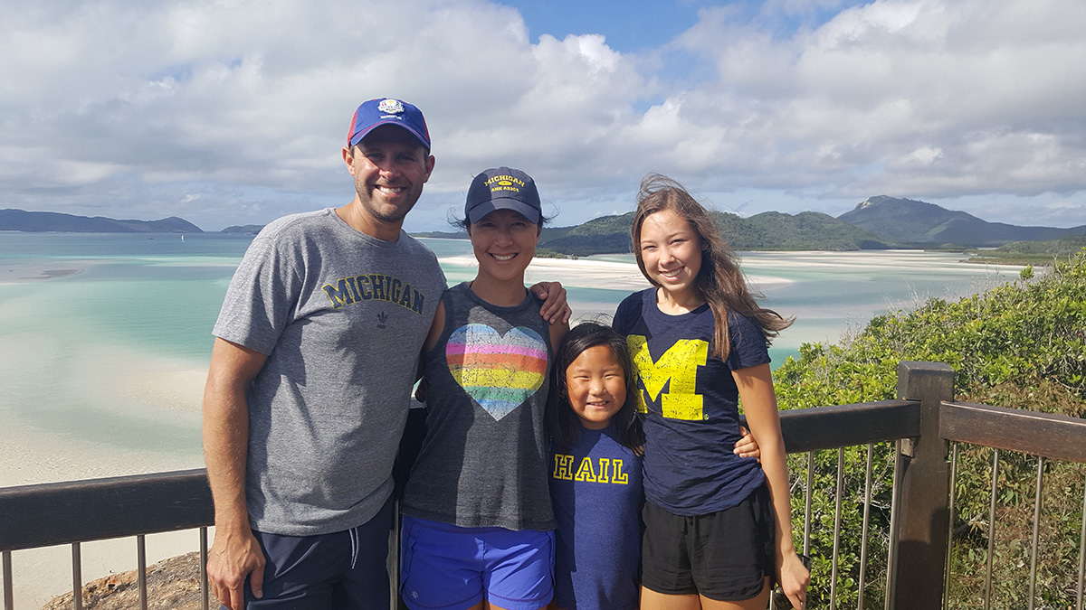 Patrick, ’97, Kelly, ’98, and daughters Adelaide and Evelyn McGinnis brought their Michigan Pride to Whitehaven Beach in Queensland, Australia.