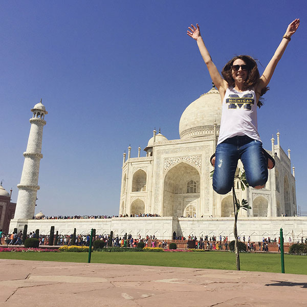 Graduate student Stephanie Podolsky, ’16, jumps for Wolverine joy at the Taj Mahal in Agra, India.