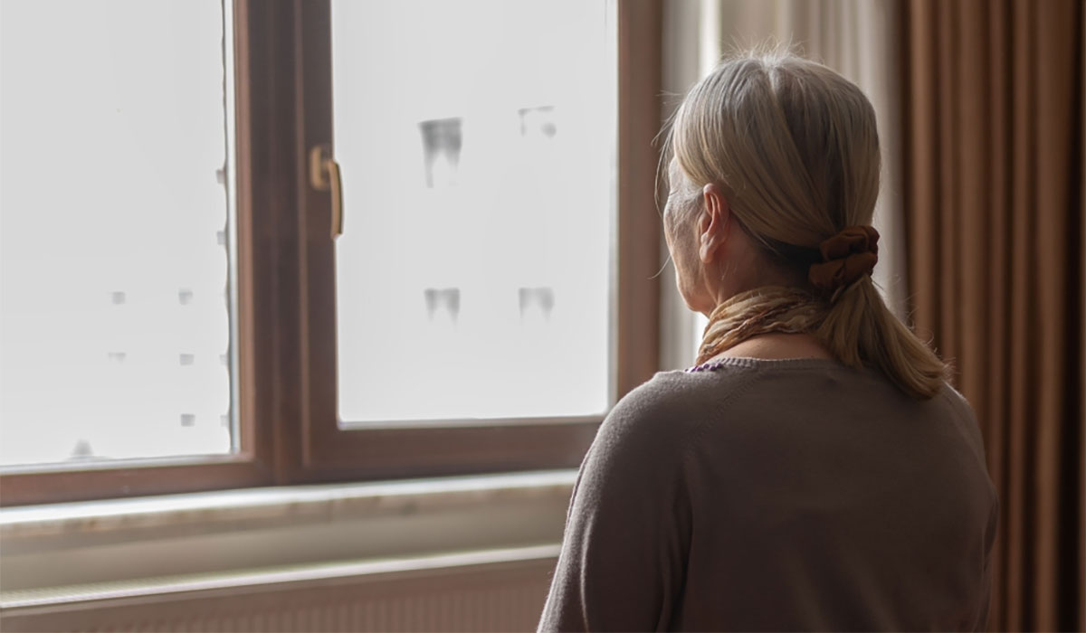 Woman Staring Out Window (1)